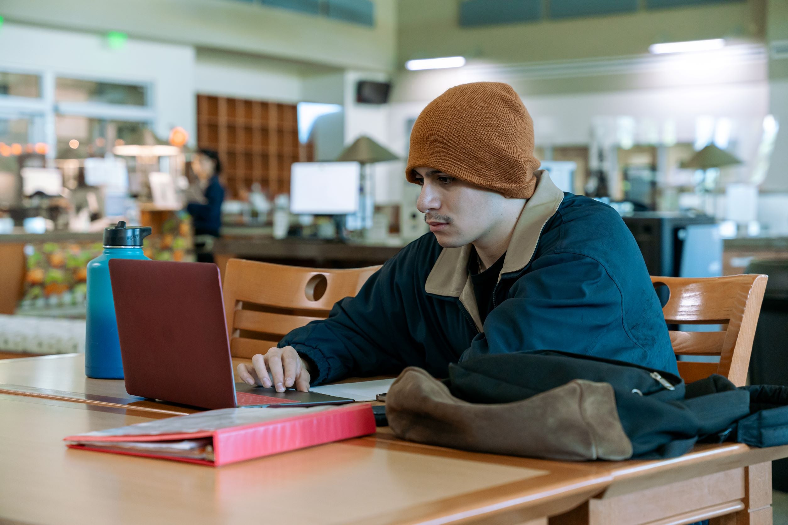 male student using laptop