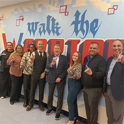Western High School Campus Tour: President Klippenstein poses with students and staff during a Western High School campus tour.