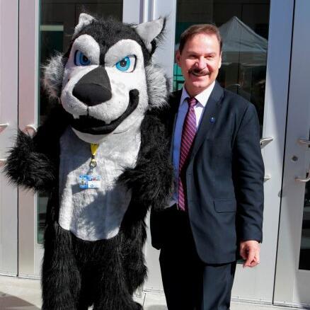 CSN President Dr. Zaragoza and Coyote mascot 